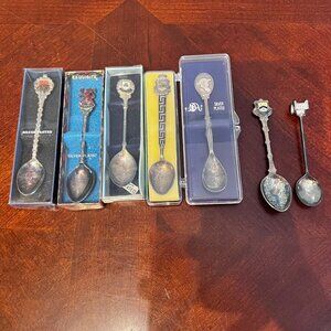 Set Of 7 Collectible Silver Plated Souvenir Spoons With Various Designs